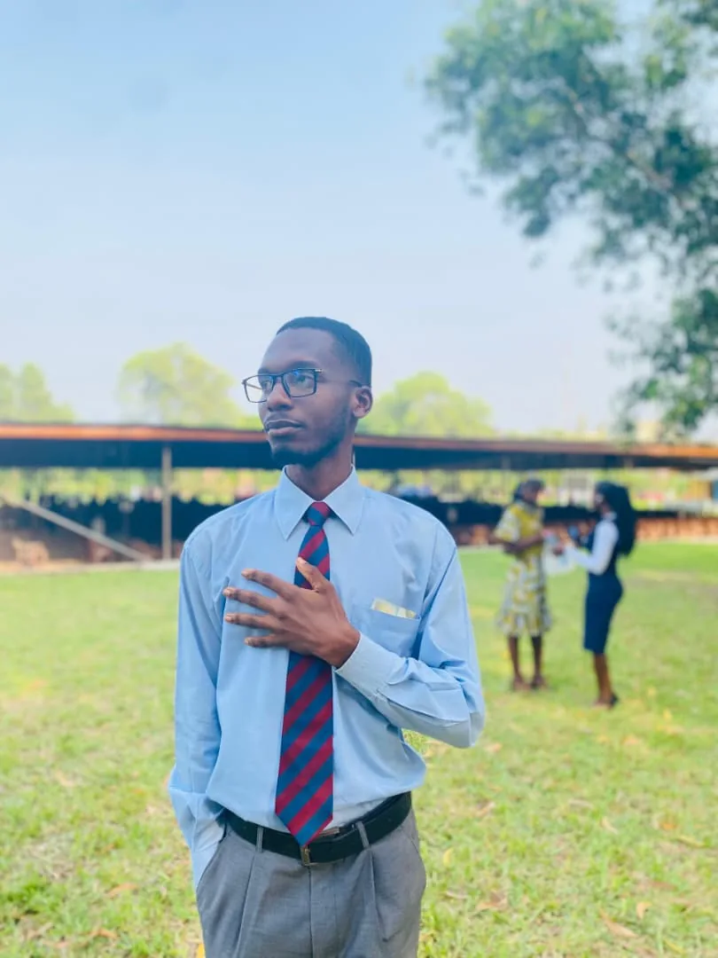 Leonard in a shirt and tie outdoors