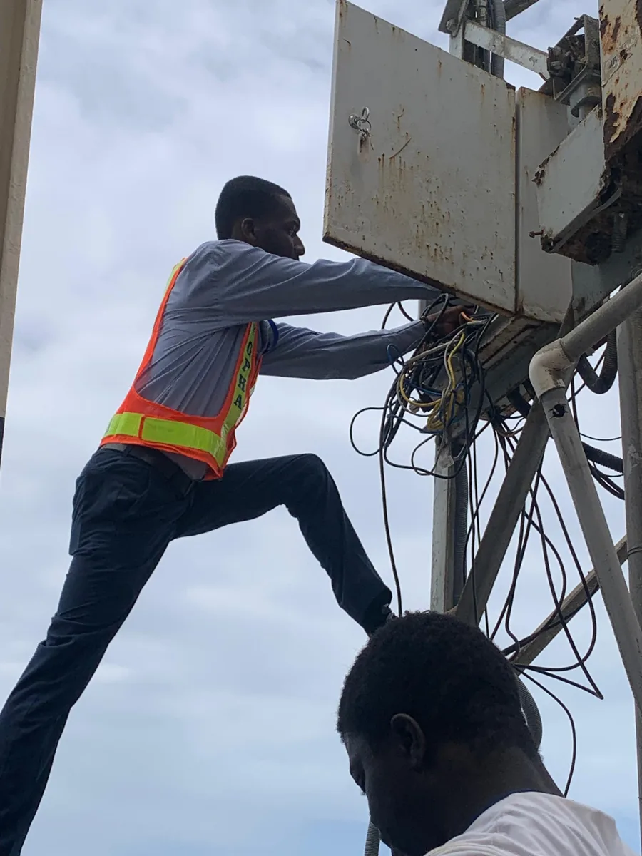 Working on cabling in an outdoor equipment box